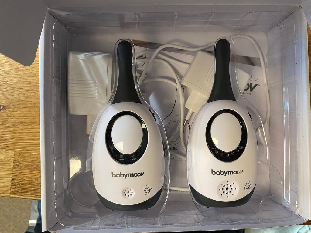 White parent unit of a baby monitor with a small screen and a short aerial