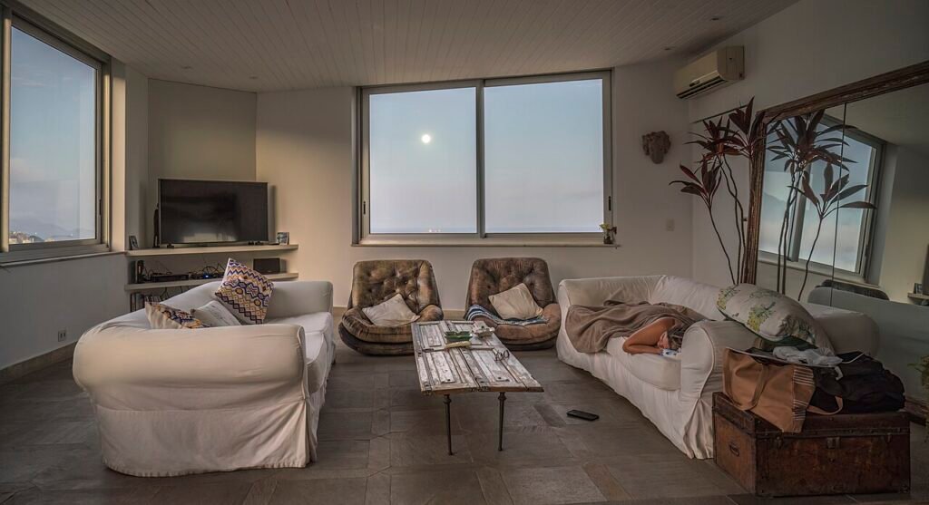 Furnished living room with a sofa, coffee table and window